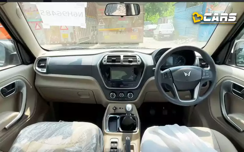 Mahindra bolero neo spied with new twin peaks logo